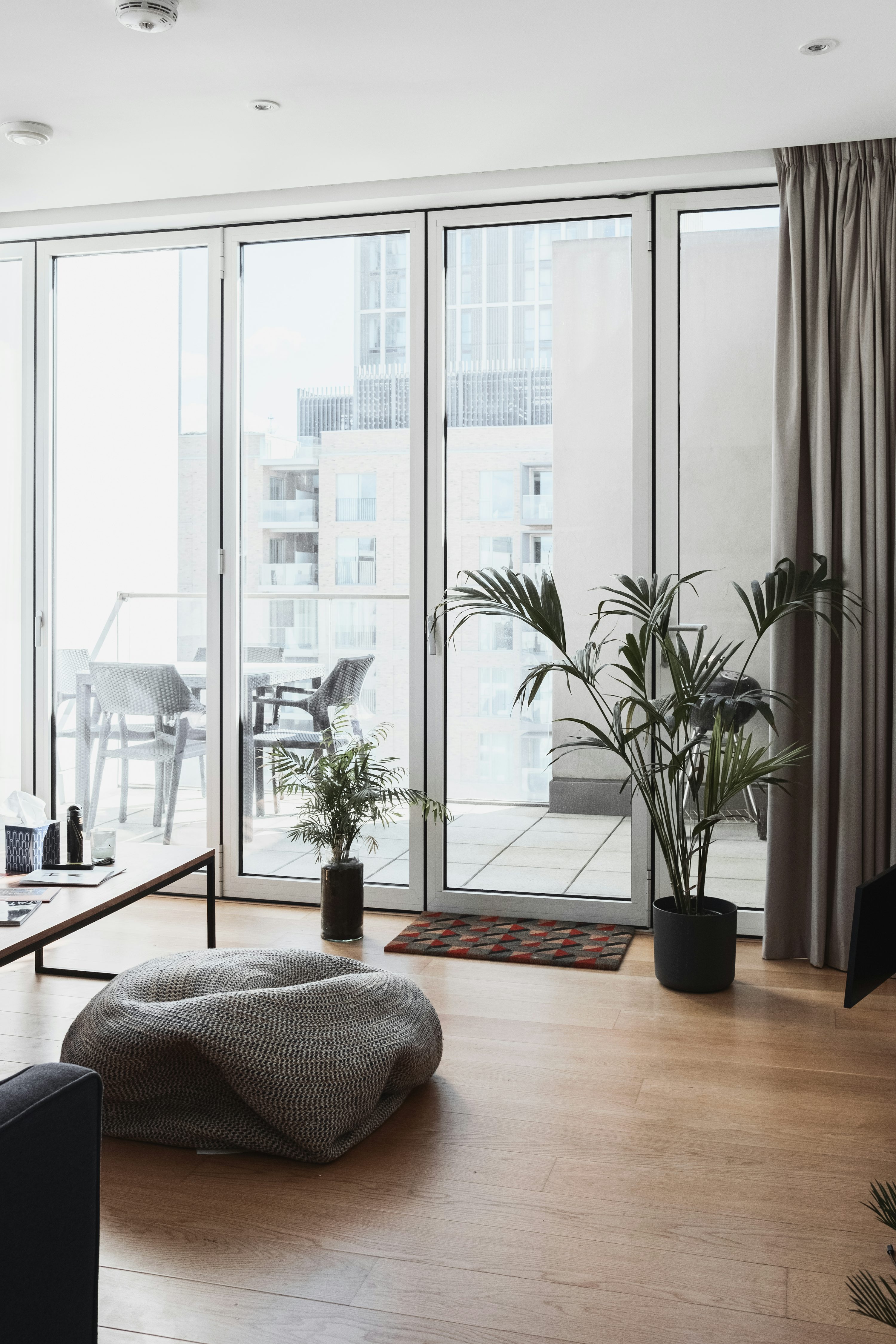 Beautiful multi-panel sliding glass doors allowing natural light into modern living room